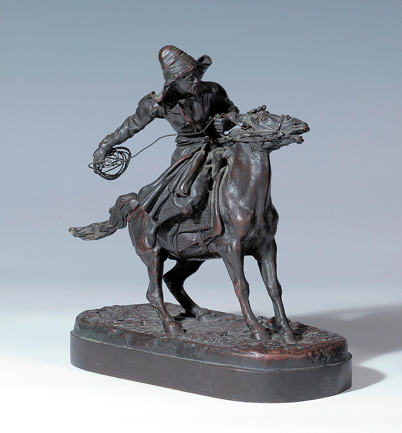 A Bronze Figure of a Horseman