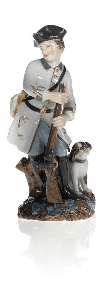 A Porcelain Figurine of a Young Huntsman with His Dog