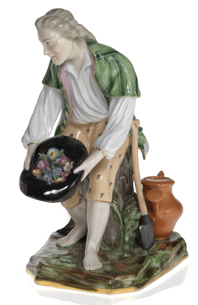 A Porcelain Figurine of a Young Gardener with a Hat Full of Flowers