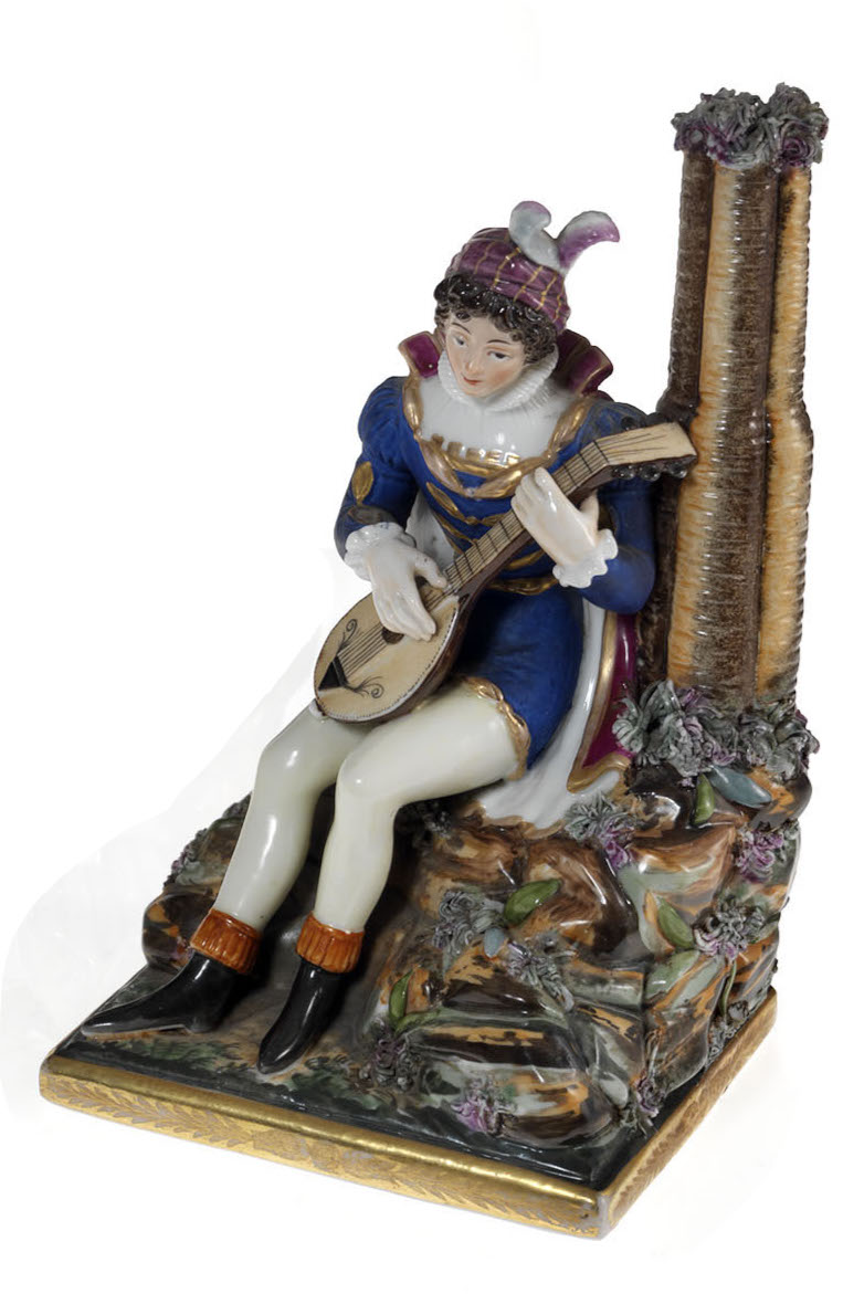 A Porcelain Figurine of a Lute Player