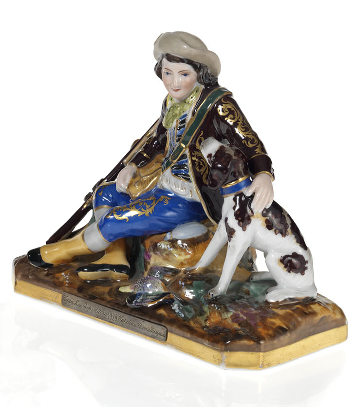 A Porcelain Figurine of a Young Huntsman with a Hound