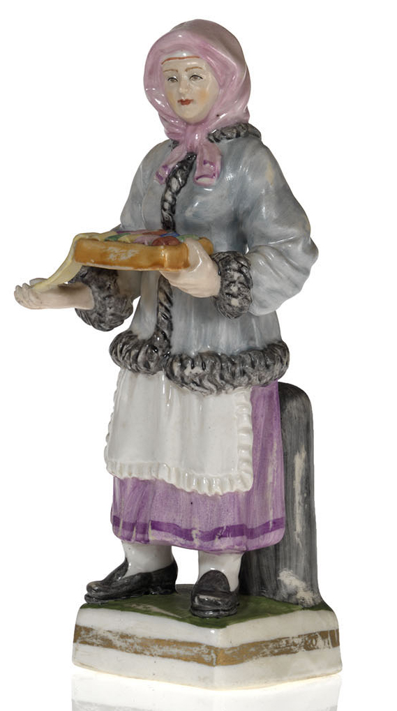 A Porcelain Figurine of a Ribbons Vendor