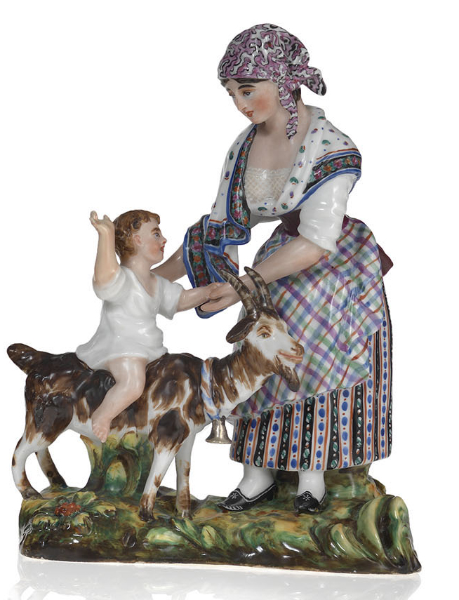 A Porcelain Figurine of a Woman with a Child Riding a Goat