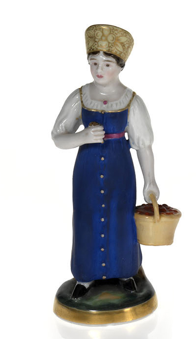 A Miniature Porcelain Figurine of a Cherry Gatherer
