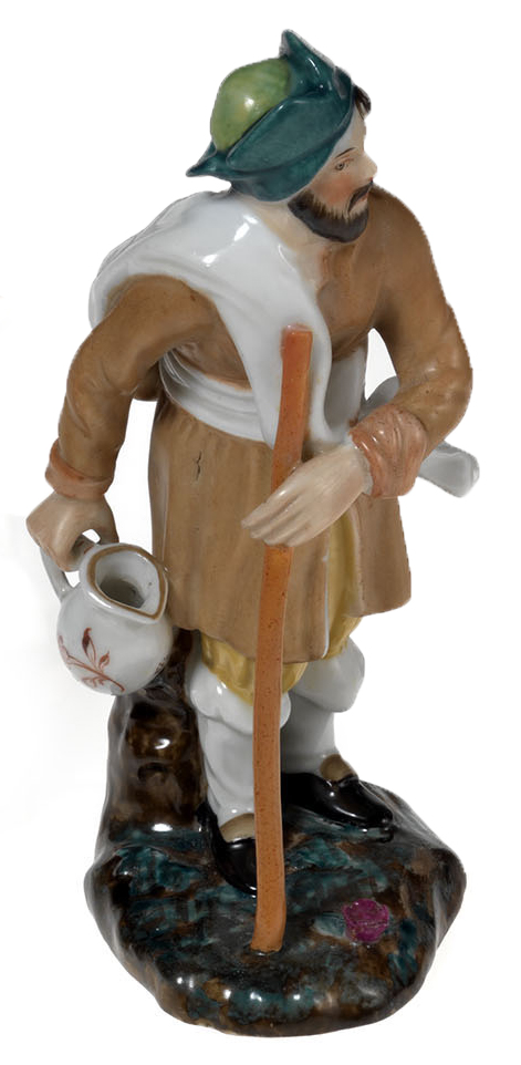 A Miniature Porcelain Figurine of a Traveller