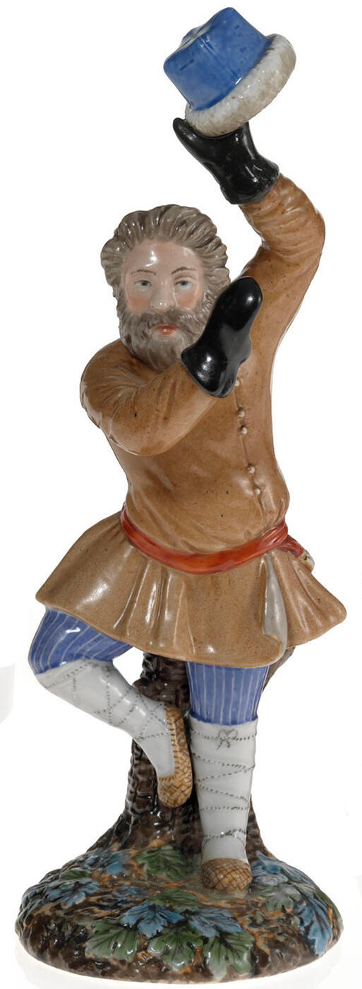 A Porcelain Figurine of a Dancing Peasant