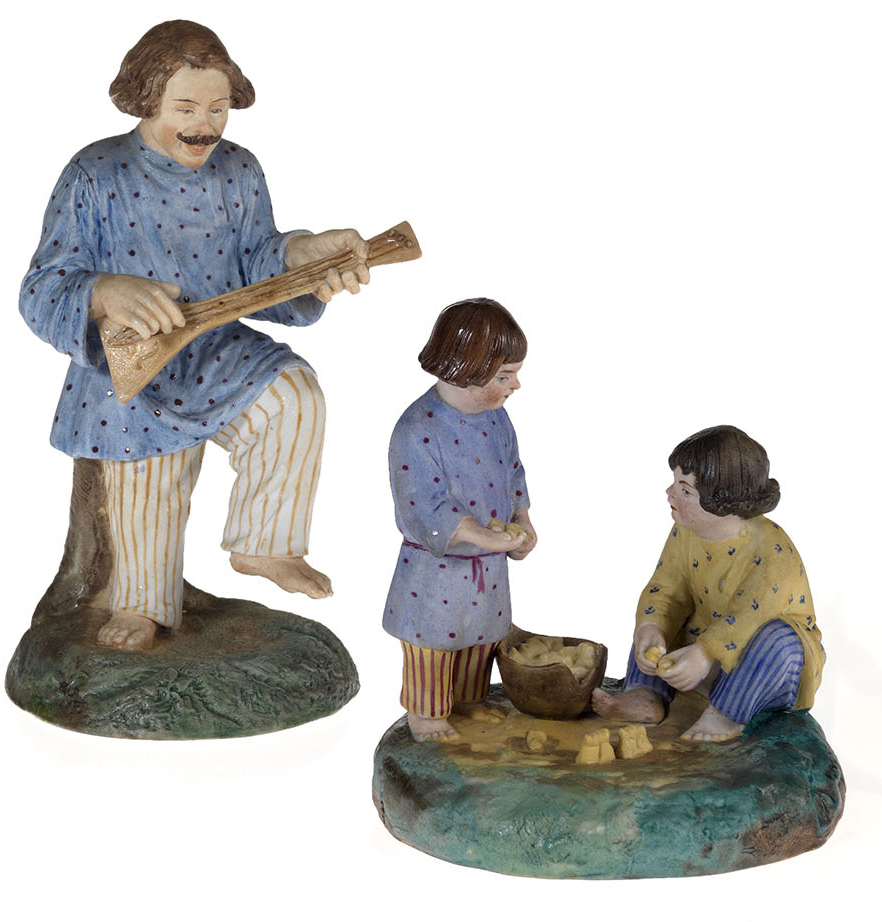 Two Porcelain Figurines of Children Playing with Pegs and a Balalaika Player