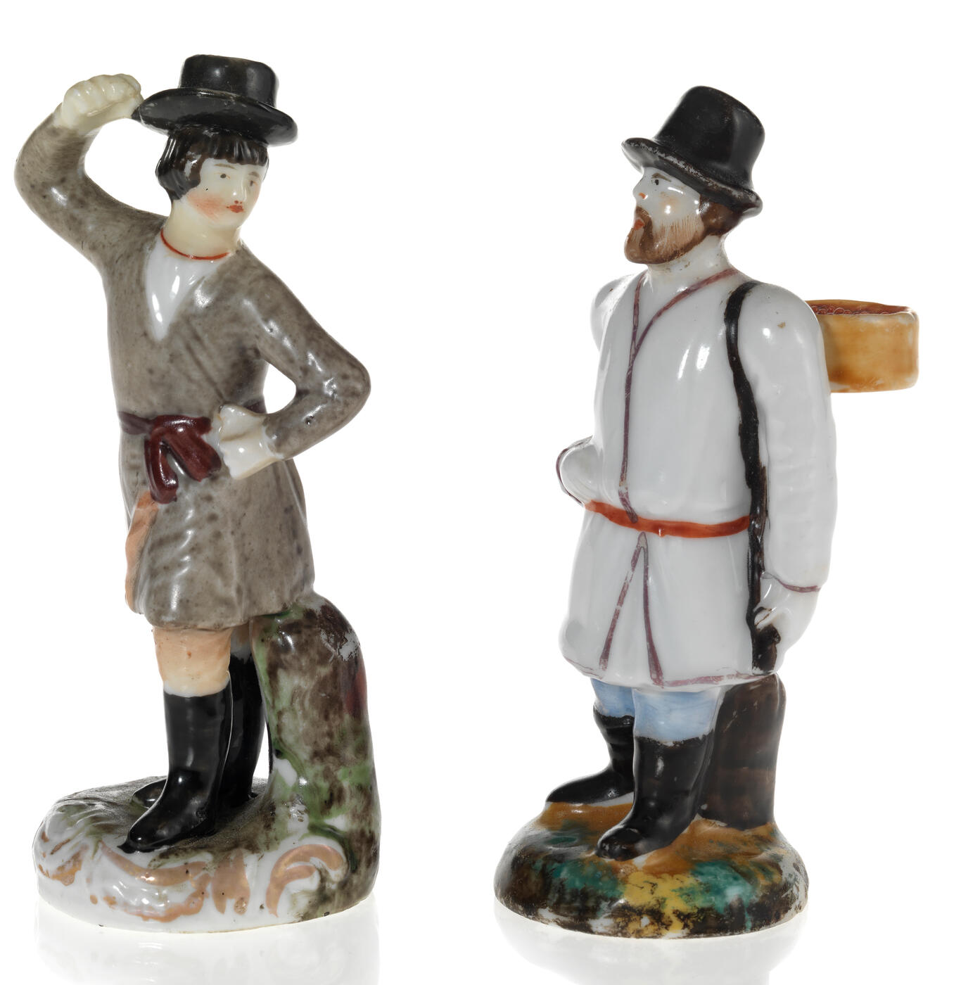 Two Small Figurines of a Dancing Peasant and a Traveller with a Basket of Berries