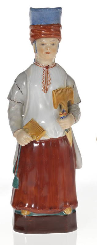 A Porcelain Scent Bottle in the Form of a Peasant Carder Woman