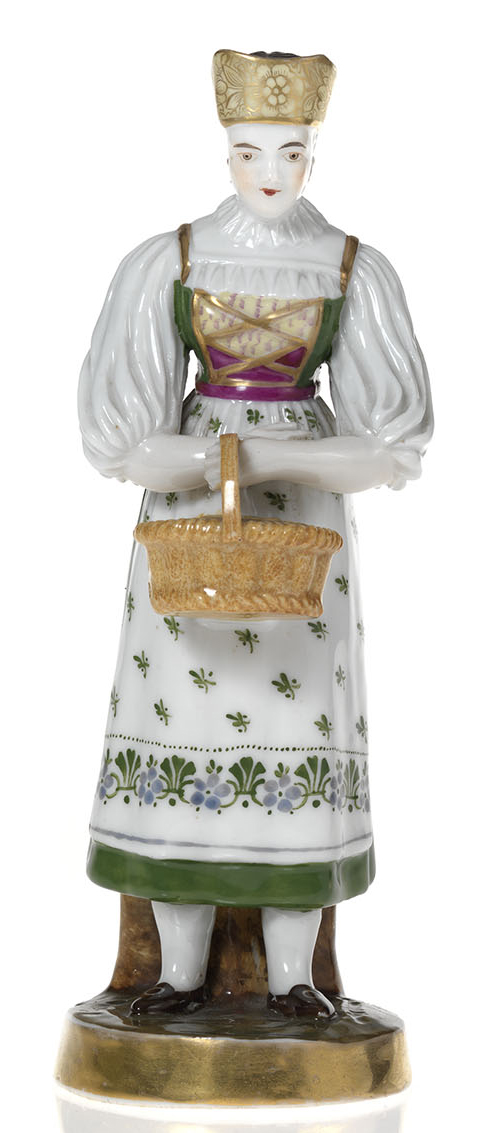 A Porcelain Figurine of a Young Woman with a Basket