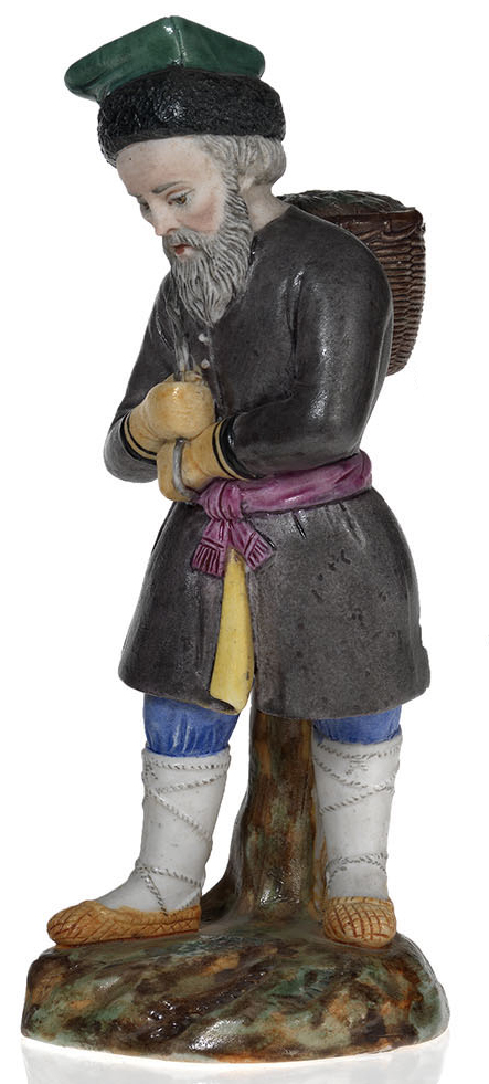 A Part Glazed Biscuit Porcelain Figurine of a Peasant with a Basket