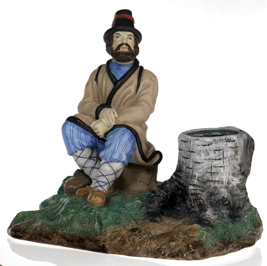 A Biscuit Porcelain Ink Stand in the Form of a Peasant Resting Beside a Tree Stump