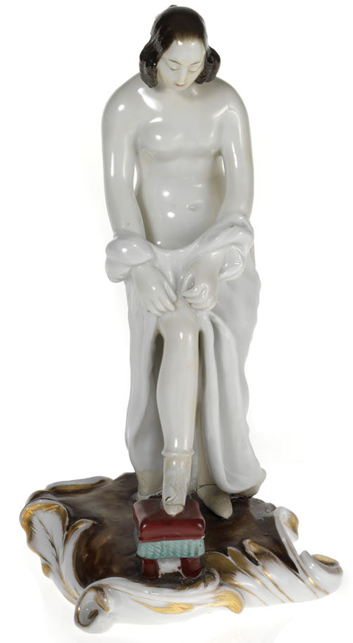 An Amusing Erotic Porcelain Figurine of a Woman Adjusting Her Stocking