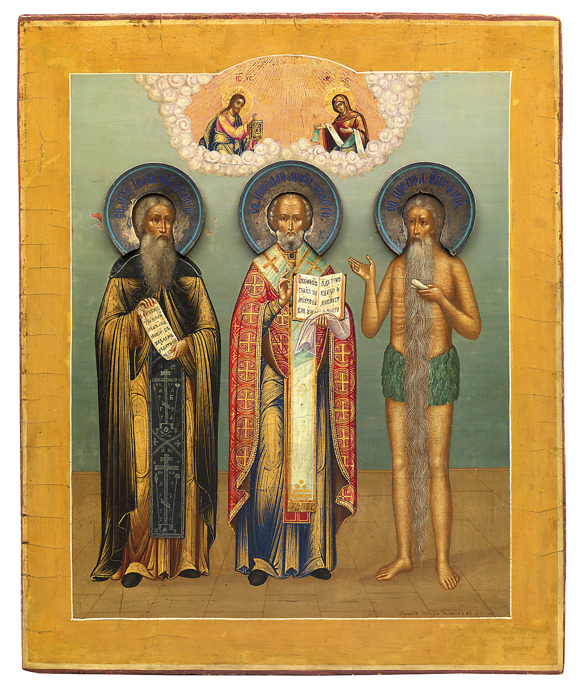 A Fine Russan Icon of St Nicholas the Miracle Worker, Ioannikiy and Onufriy the Great with Silver and Enamel Haloes