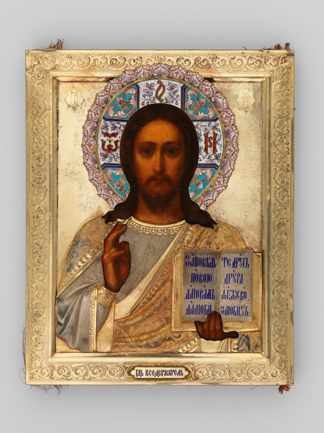 An Icon of Christ Pantocrator in Silver-Gilt and Engraved Oklad with Enamel Halo