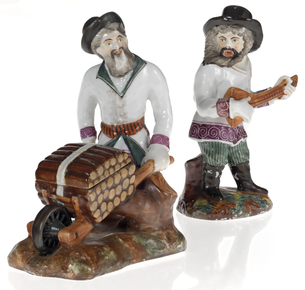 Two Porcelain Figurines of a Peasant Balalaika Player and a Peasant with a Wood Cart