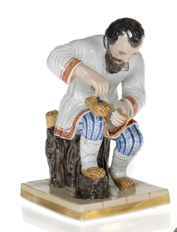 A Porcelain Figurine of a Peasant Making a Bast Shoe