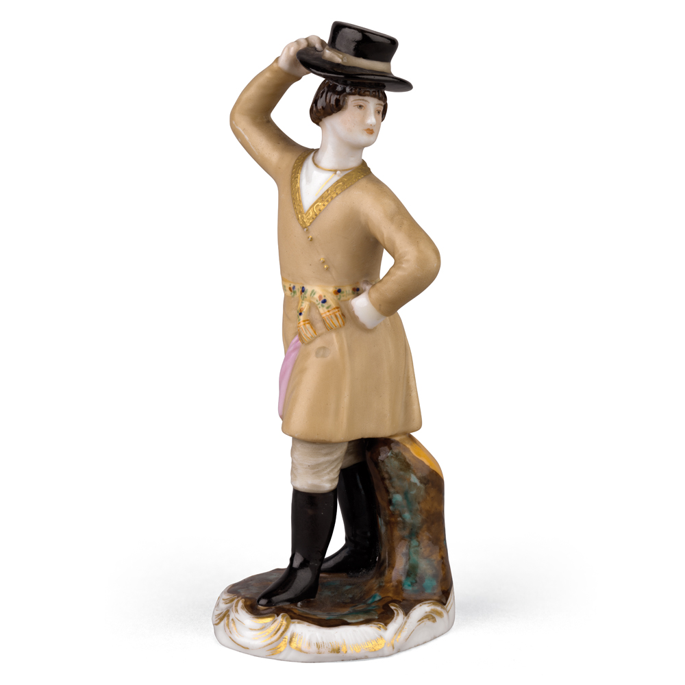 A Small Porcelain Figurine Of A Peasant Dancing