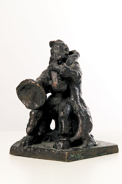 A Bronze Figure of a Trombone Player