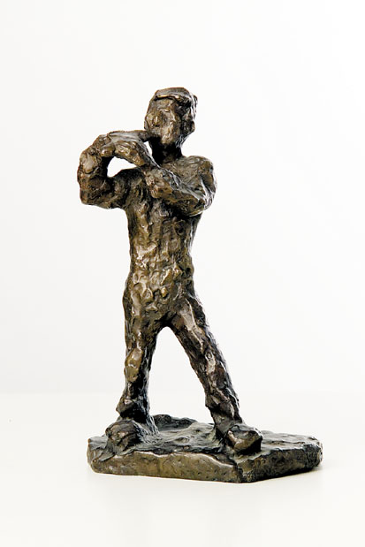 A Bronze Figure of a Boy with a Flute