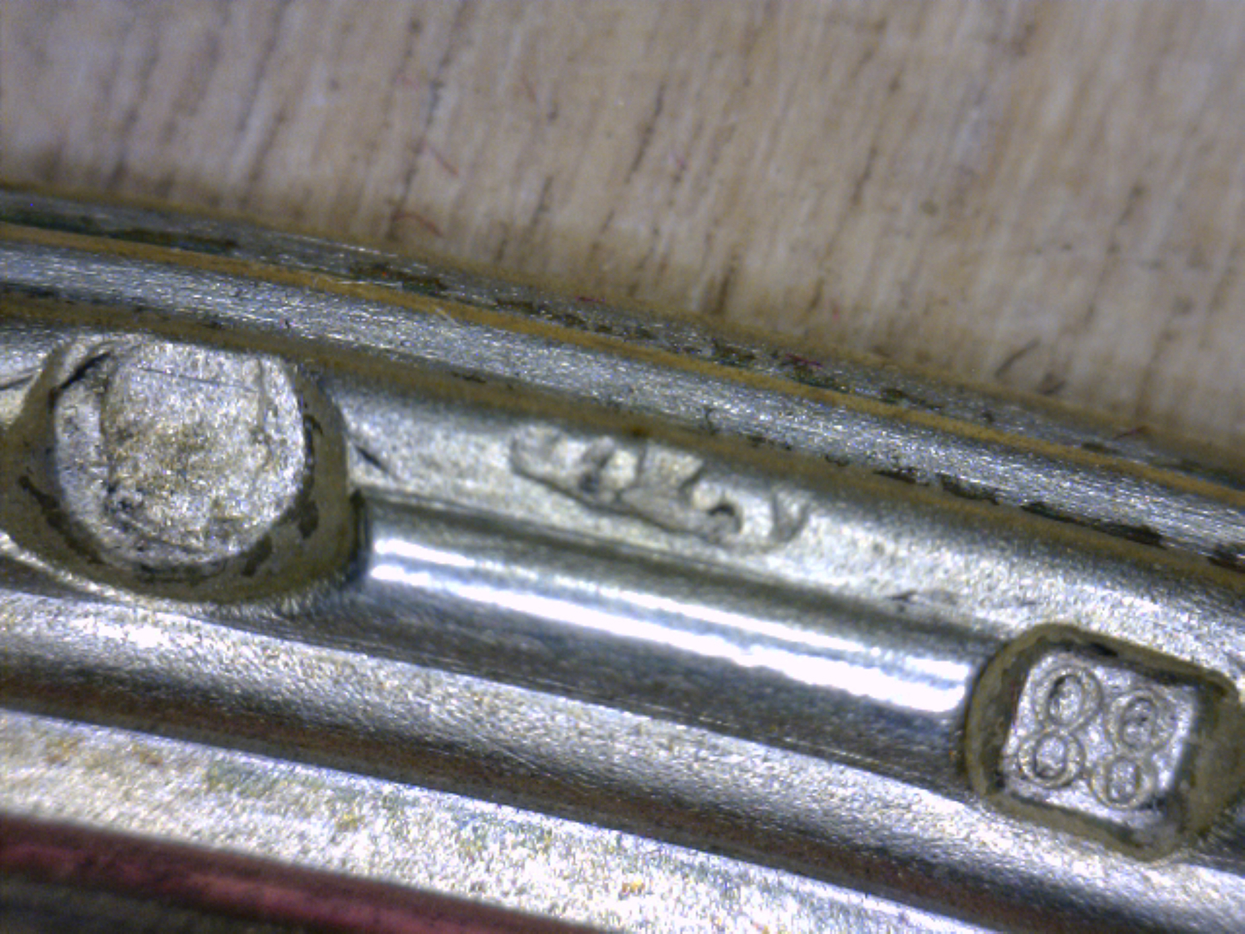 A Fabergé Wood Silver-Gilt and Guilloché Enamel Photograph Frame