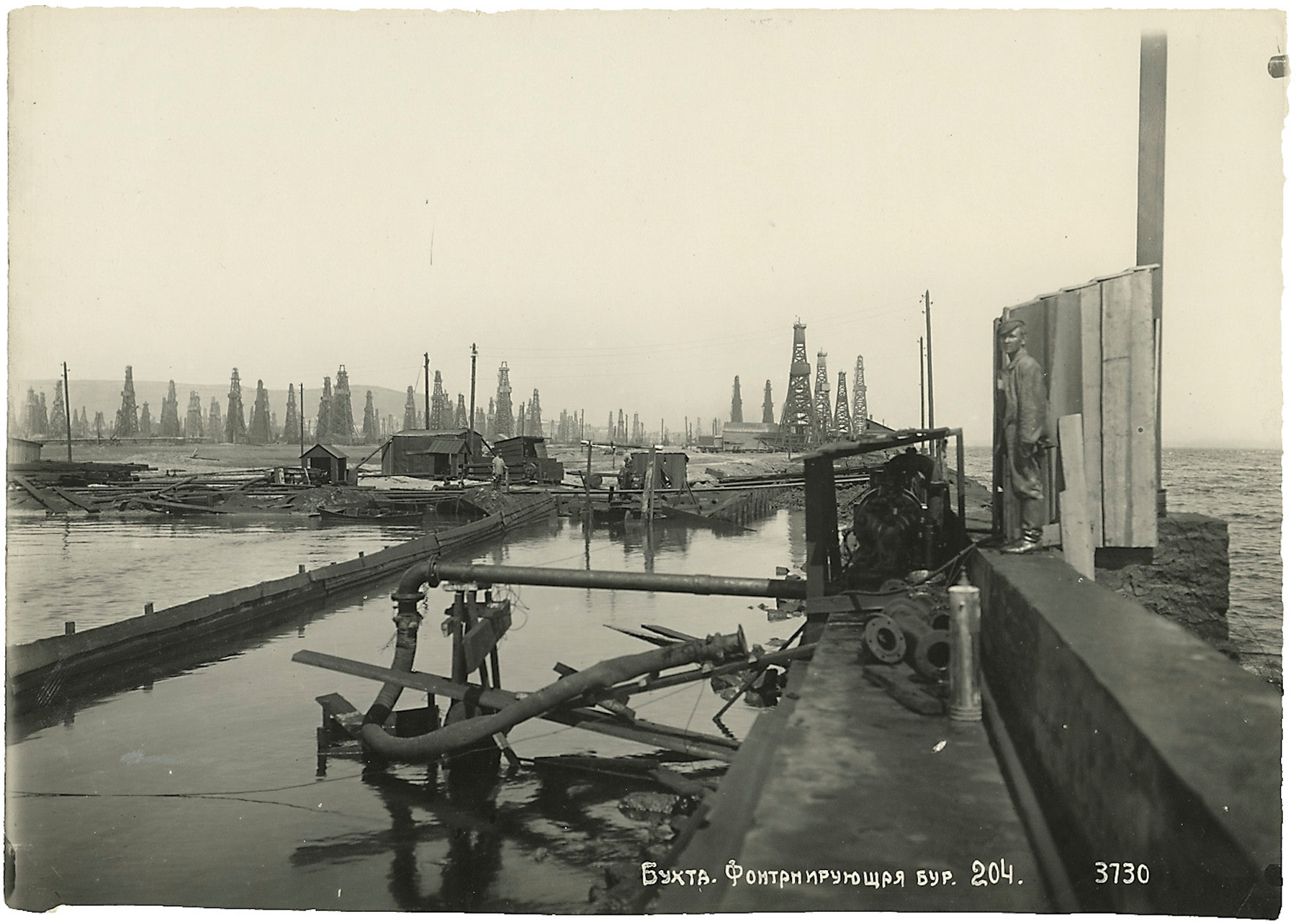 Views of Baku Harbour with Quays and Oil Rigs, an Oil Derrick, and the Neftchala Settlement